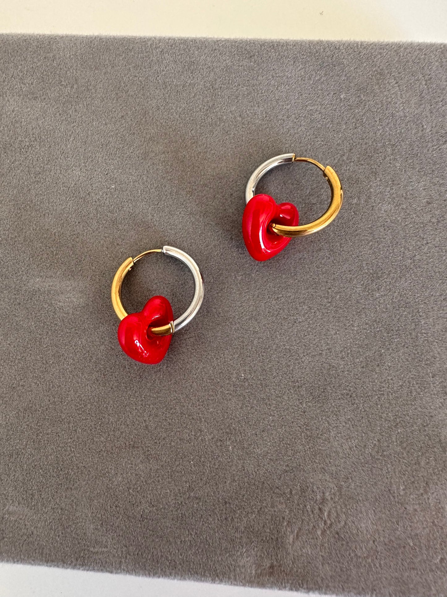 Cooler than Sin: Mixed Metals Huggie hoops with red glass heart charm