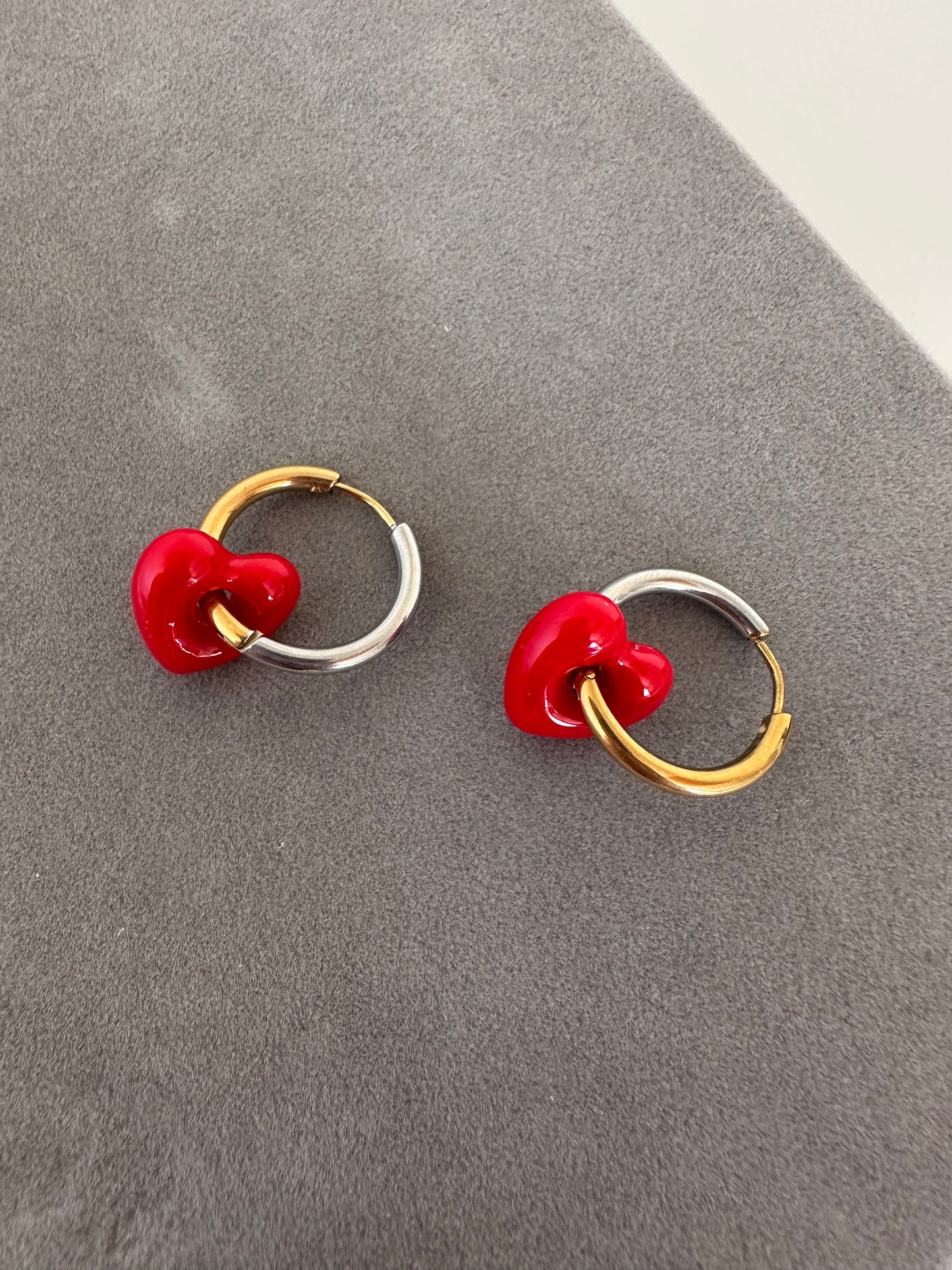 Cooler than Sin: Mixed Metals Huggie hoops with red glass heart charm